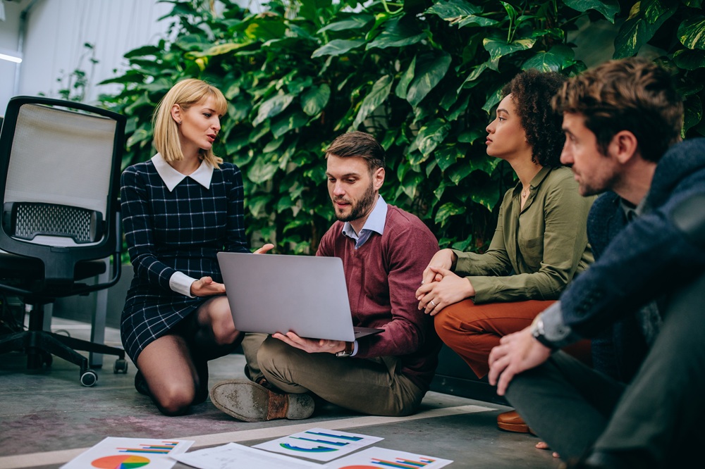 Group of coworkers having a casual meeting outside the office